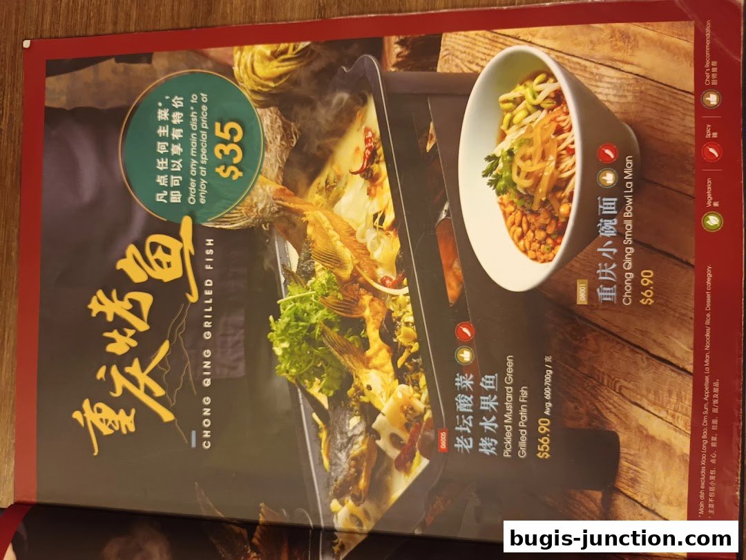 A menu page from Crystal Jade La Mian Xiao Long Bao featuring grilled fish and noodles.