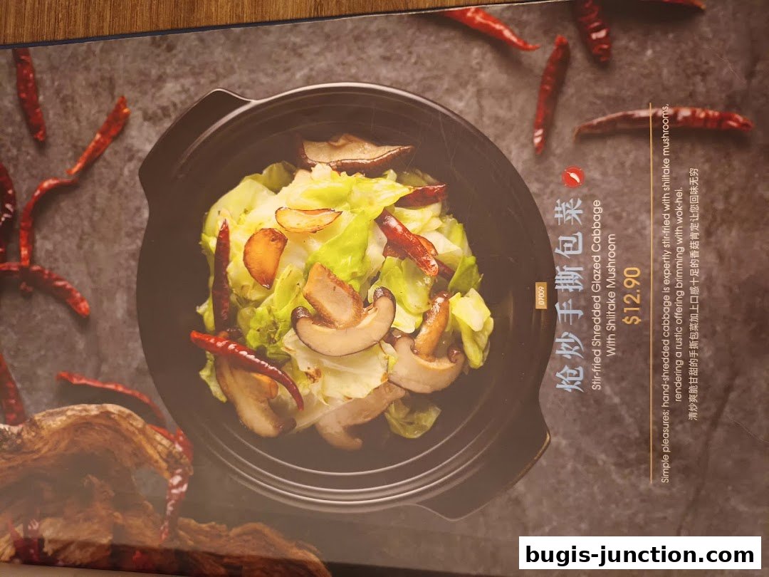A menu item featuring stir-fried shredded cabbage with shiitake mushrooms.