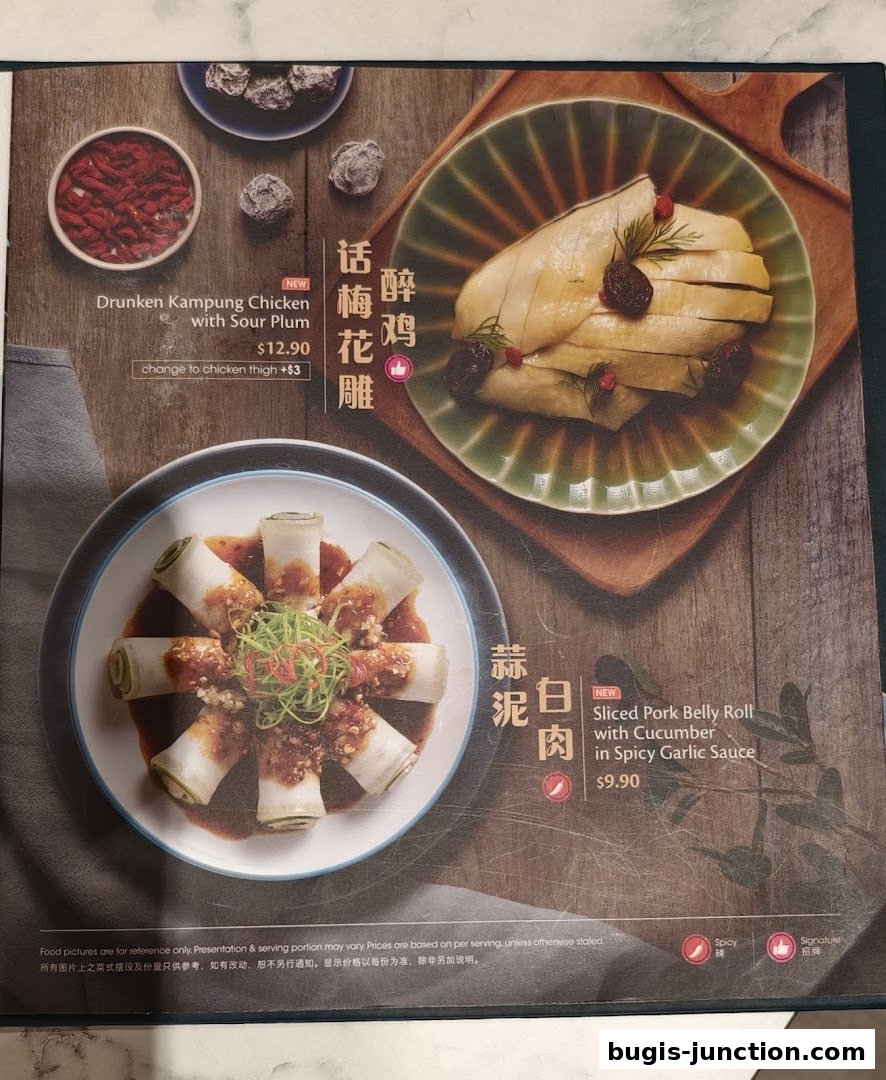 A menu page showcasing two signature dishes: Drunken Kampung Chicken and Sliced Pork Belly Roll.