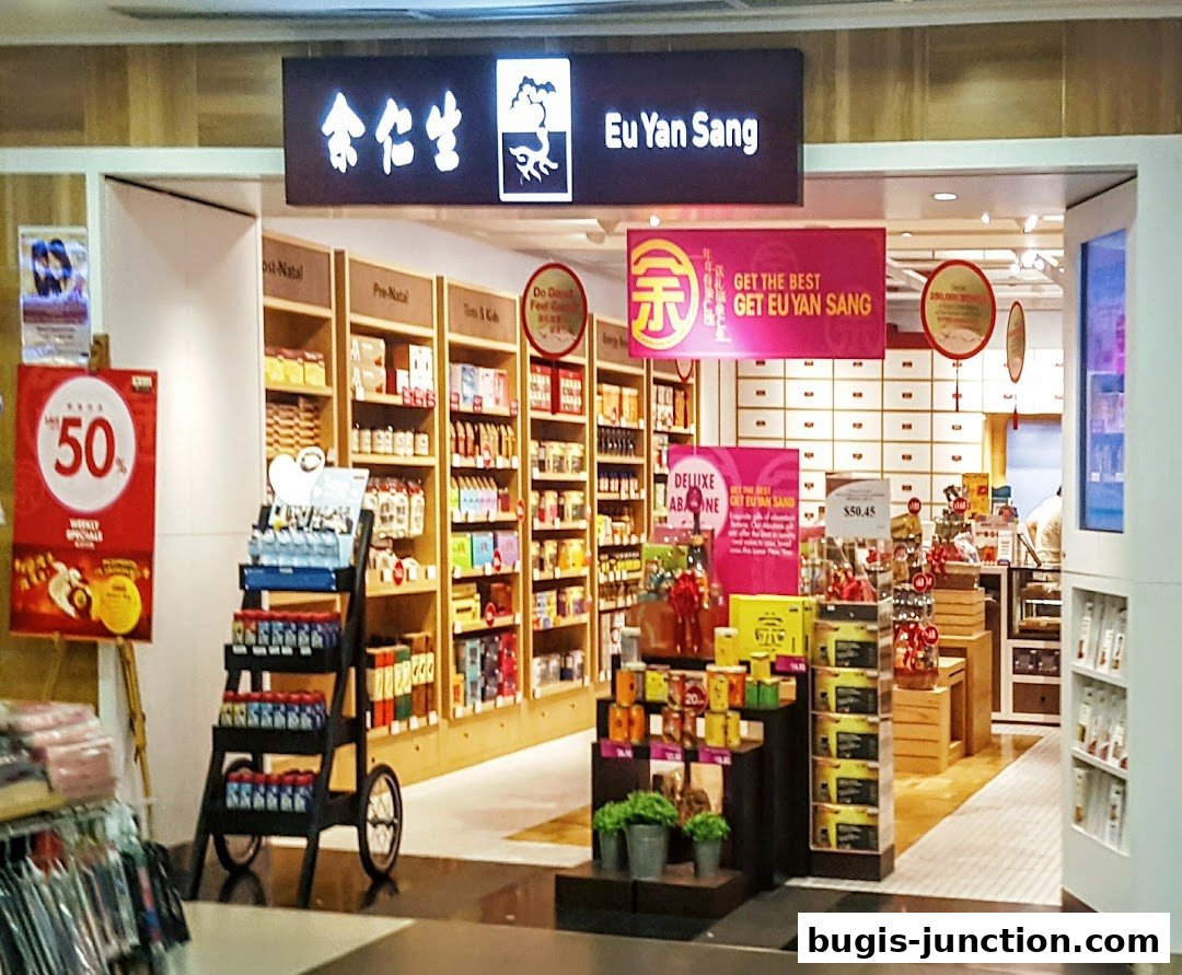 The entrance of Eu Yan Sang, a traditional Chinese medicine shop, displaying various health products and promotions.