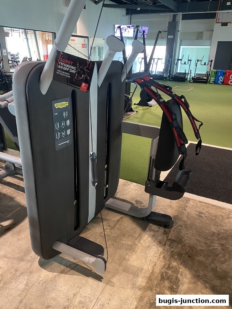 A core exercise machine with a sign indicating it's temporarily unavailable.
