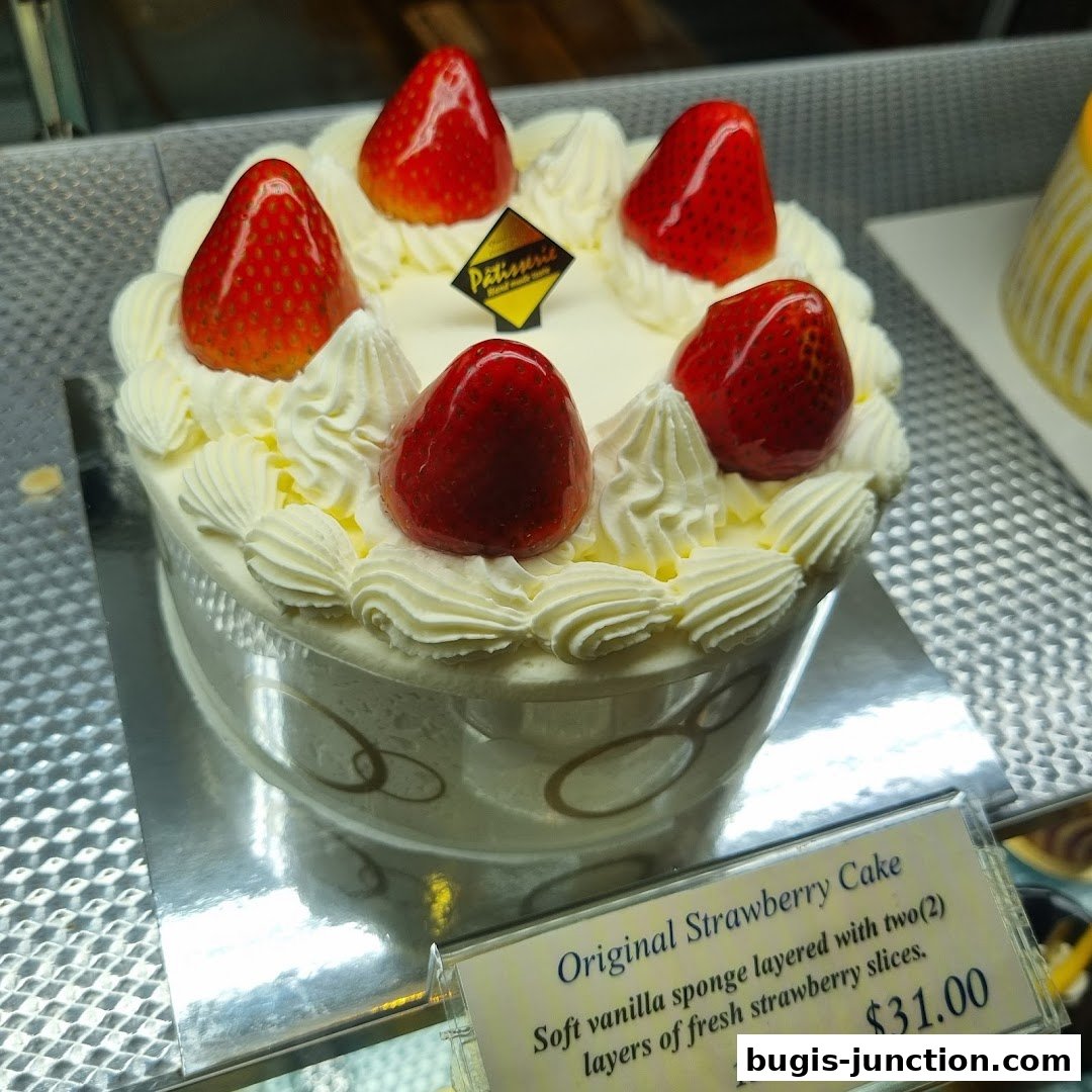 A delicious strawberry cake with fresh fruit and whipped cream.