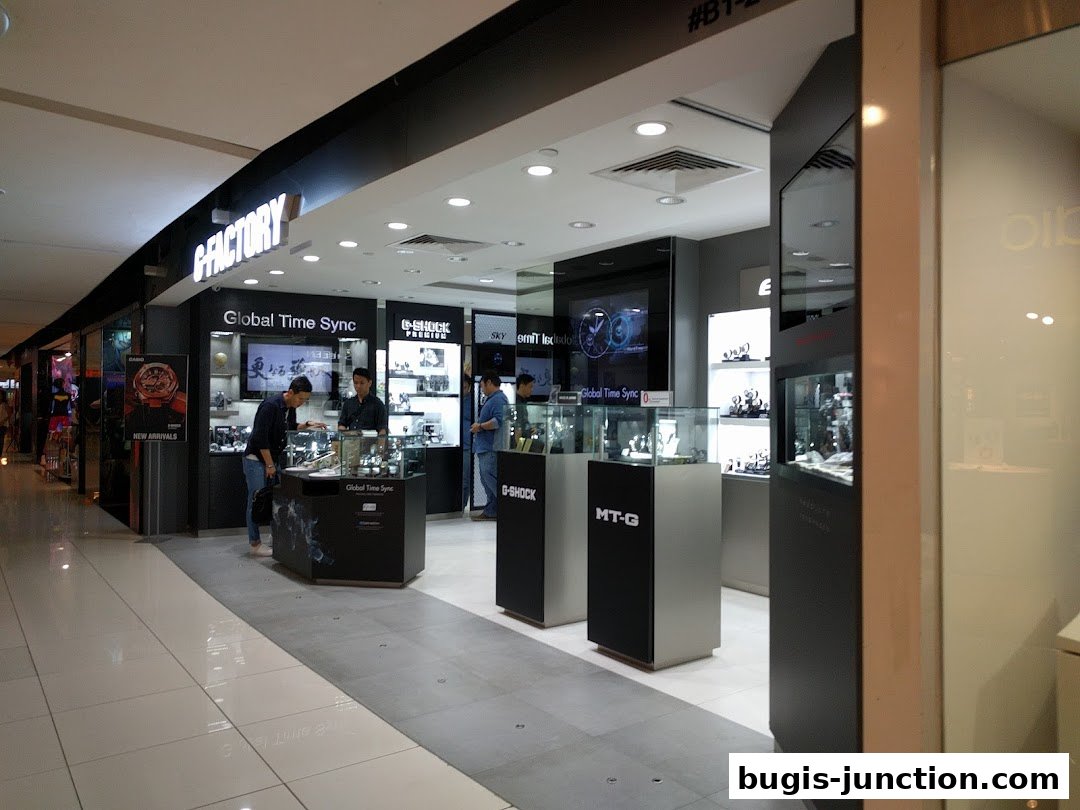 Interior view of a G-SHOCK CASIO watch store with display cases and customers.