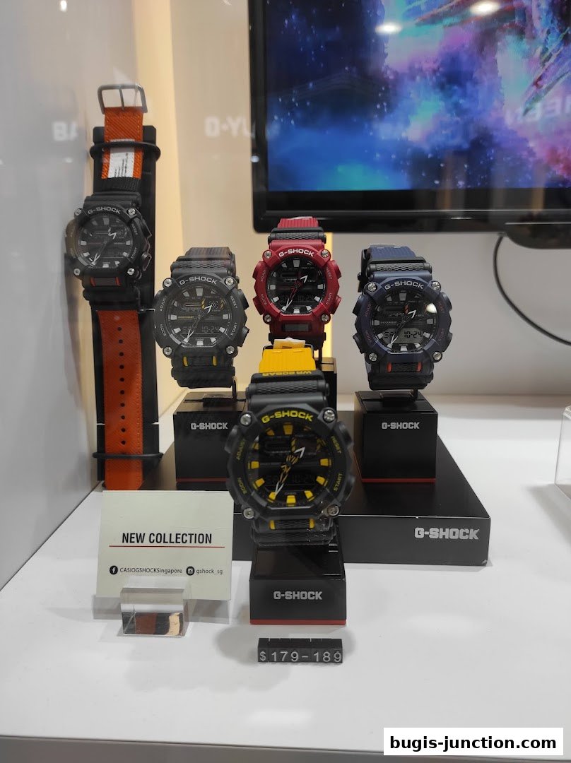 A display of various G-SHOCK watches in different colors, with a price range indicated.