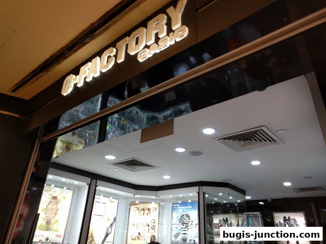 The illuminated G-SHOCK CASIO store sign above a display of watches.