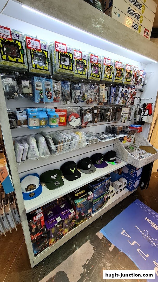 A retail display shelf stocked with video games, accessories, and merchandise.