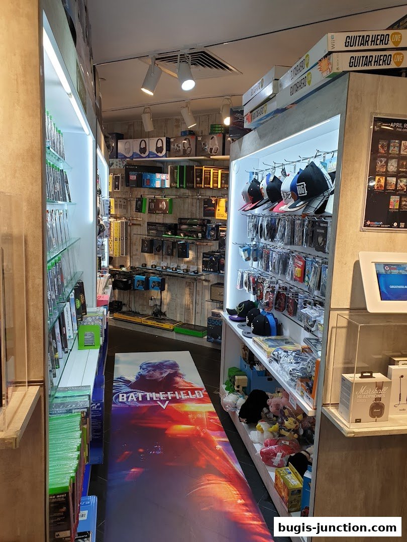 Interior view of a GameMartz store showcasing video games, accessories, and merchandise.