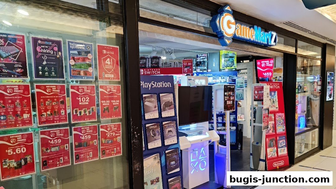 GameMartz Bugis Junction shop front displaying various promotions and gaming products.