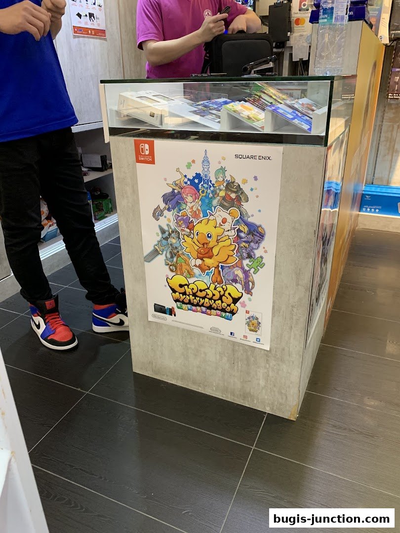 A display counter in a game store featuring a poster for a Nintendo Switch game.