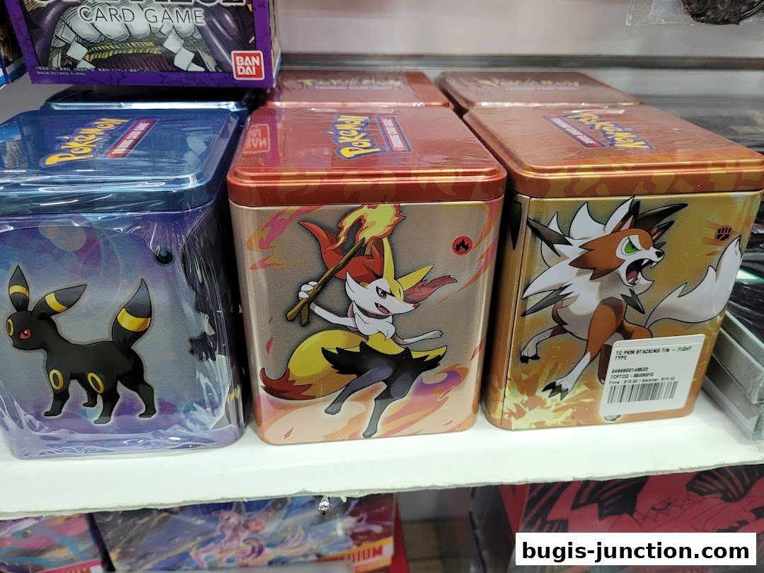 Pokemon themed tins with various characters displayed on a shelf.