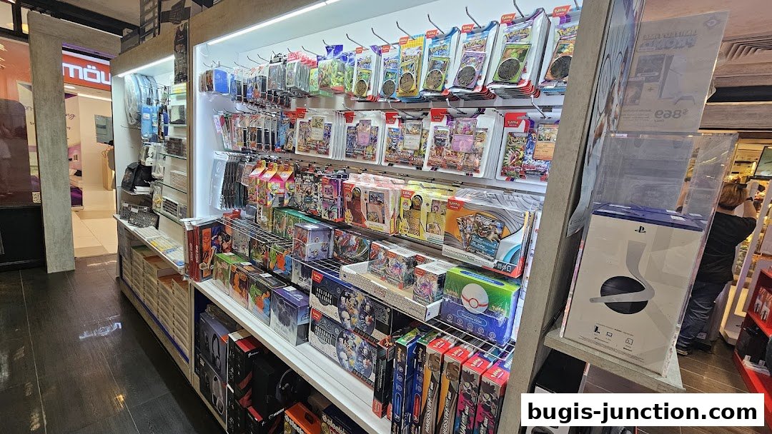 Shelves stocked with trading cards, game boxes, and accessories in a retail store.
