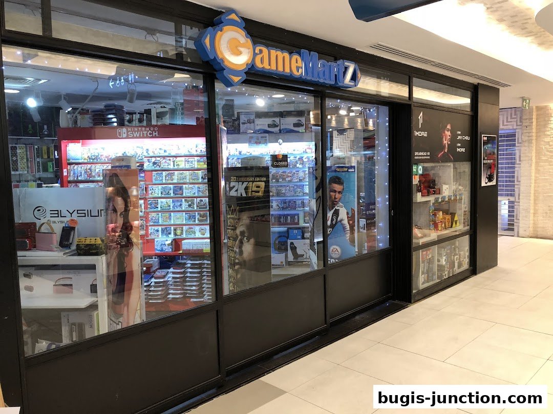 The exterior of GameMartz, a video game store, showcasing shelves of games and gaming accessories.