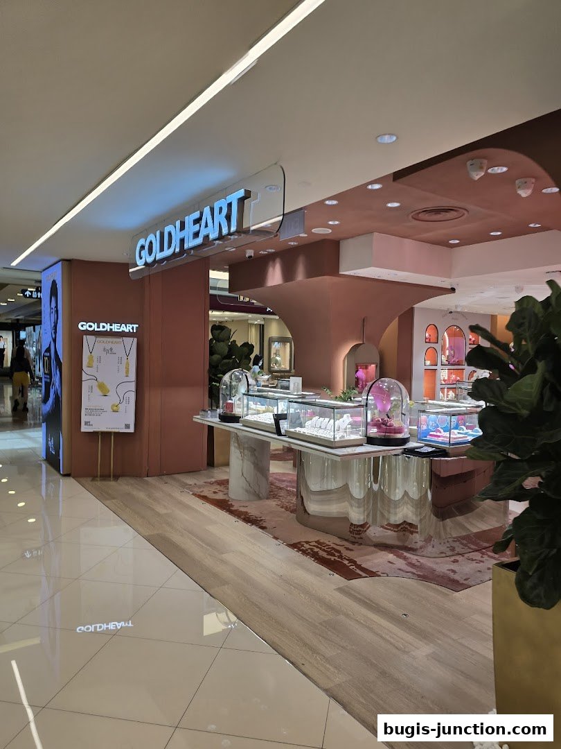 The Goldheart Jewelry store features a modern, elegant display of jewelry in glass cases.