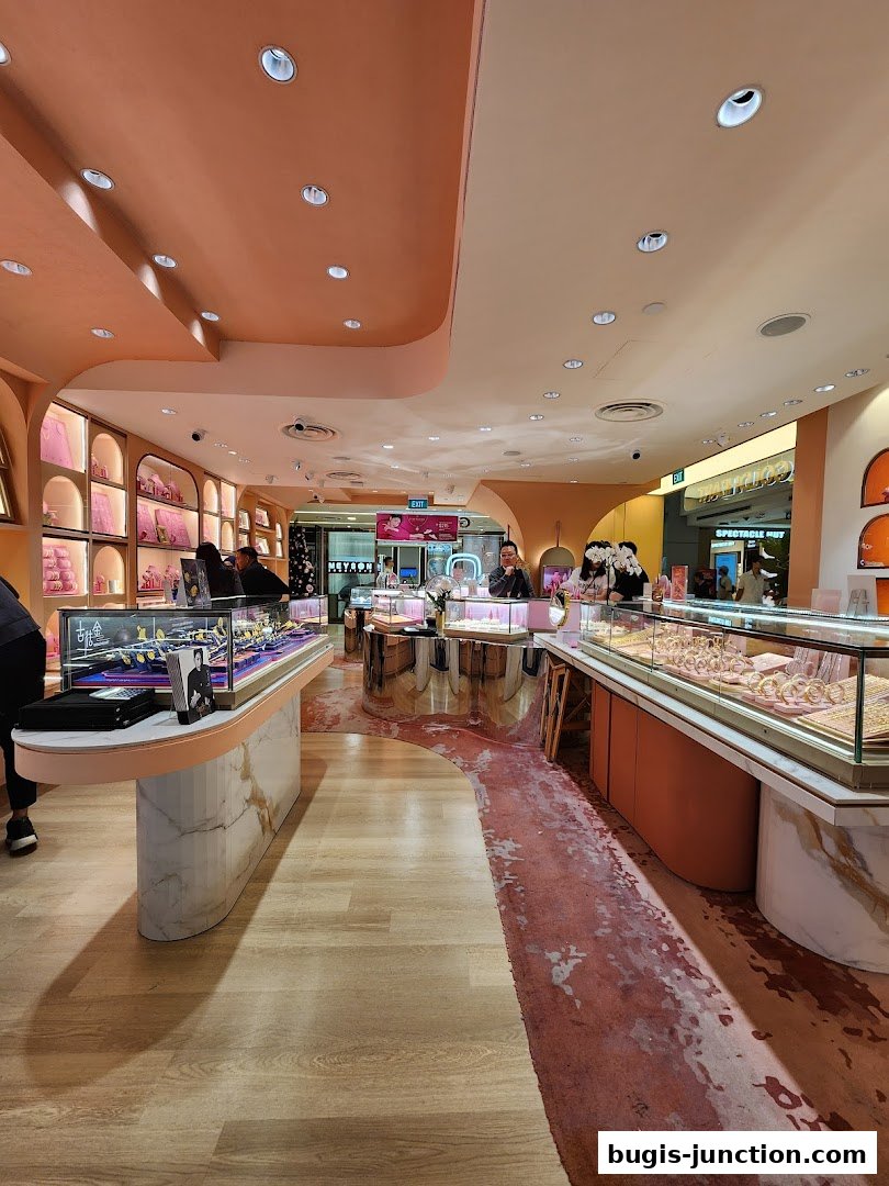 Interior view of a modern jewelry store with display cases filled with jewelry and customers browsing.