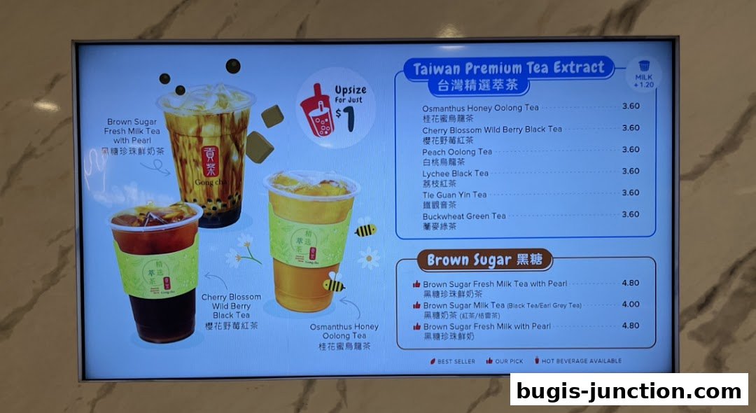 A digital menu board displaying various bubble tea options from Gong Cha.