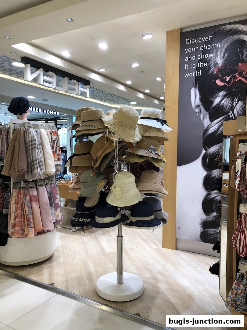 A display of various hats and scarves inside a retail store.