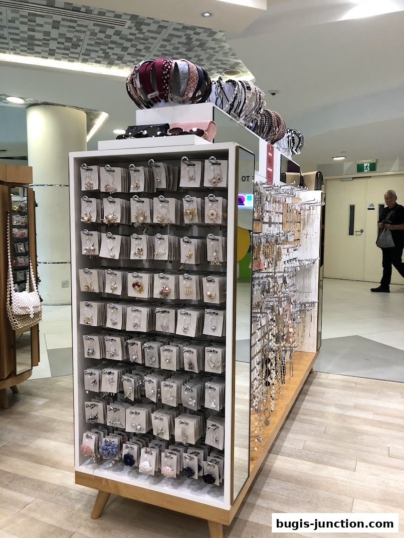 A display of fashion accessories including headbands, earrings, and necklaces.