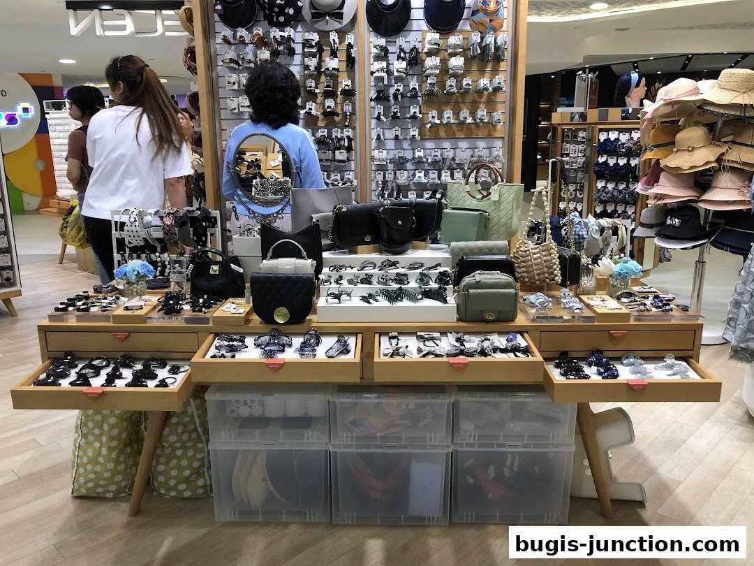 A shop display featuring a variety of hair accessories, handbags, and hats.