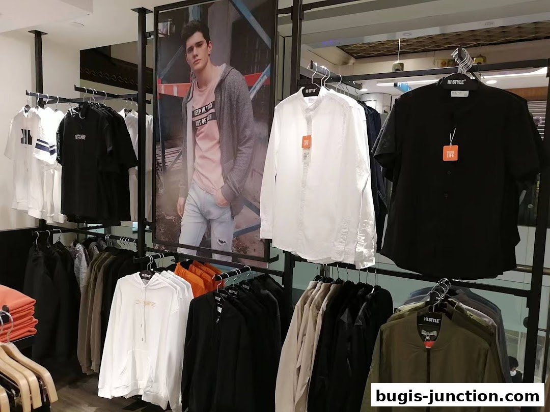 A well-organized display of men's casual wear, featuring shirts, hoodies, and jackets.