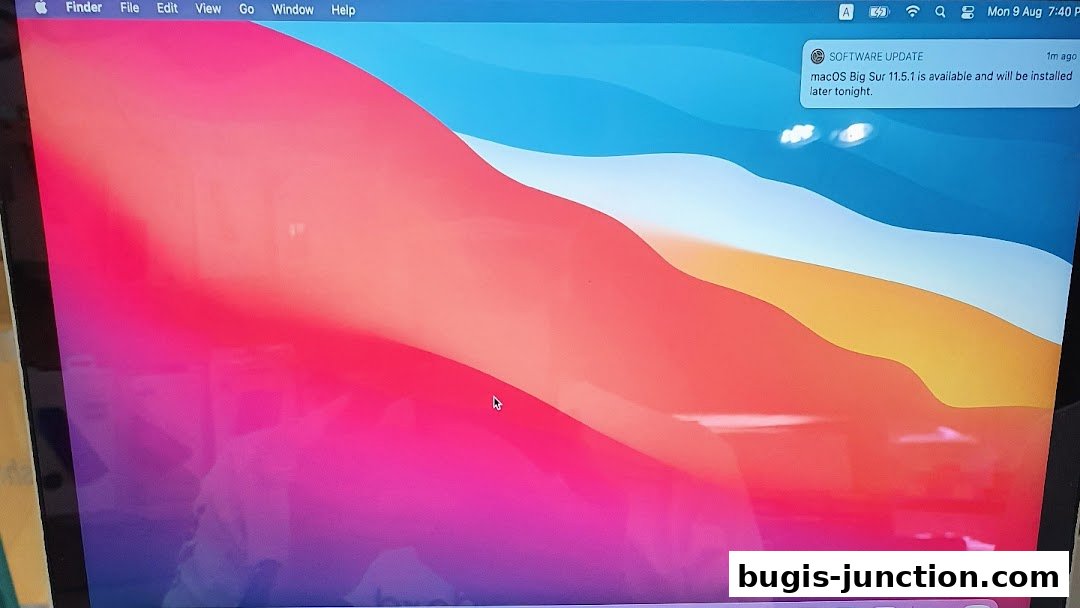 A laptop screen displaying the macOS Big Sur operating system with a software update notification.