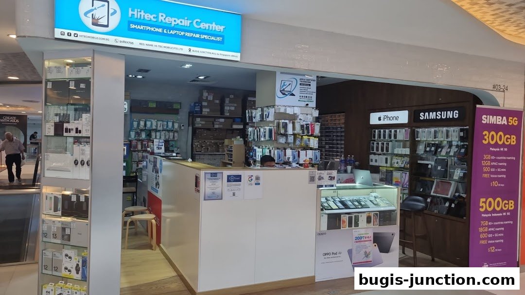 Hitec Mobile repair center shop front with displays of phones, accessories, and SIMBA 5G plans.