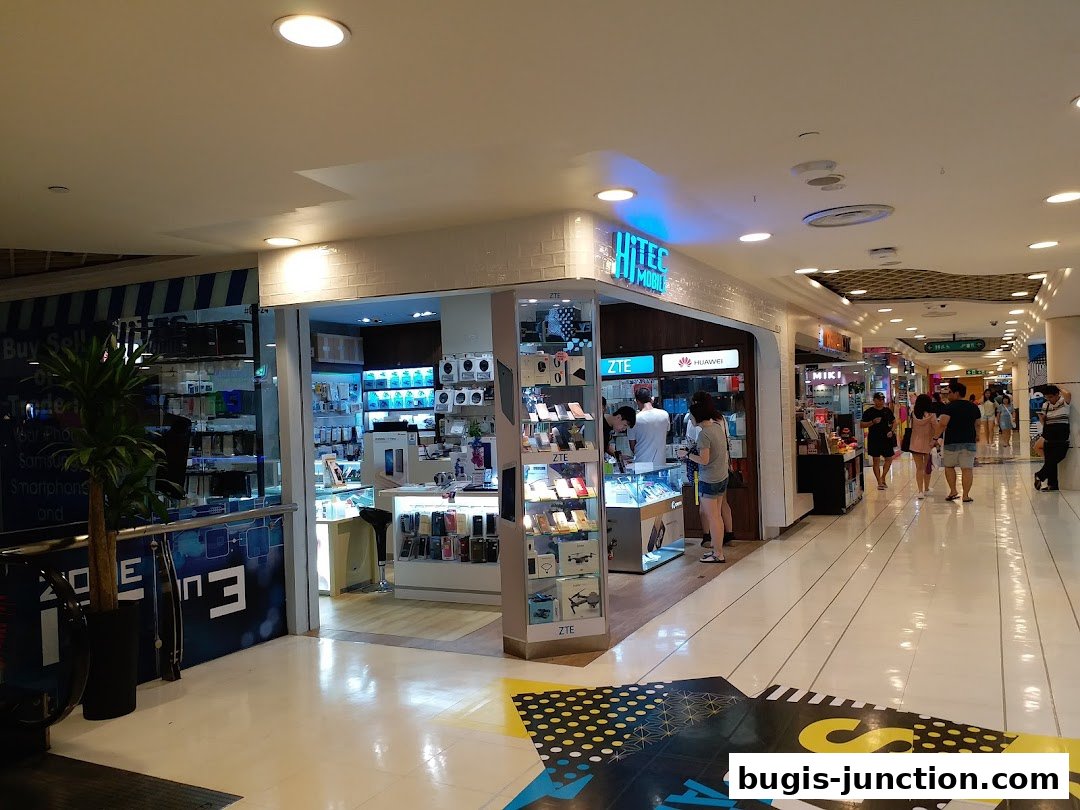 Hitec Mobile shop entrance with displays of phones and accessories in a mall.