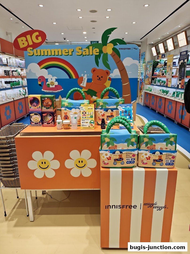 Innisfree shop display featuring a 'Big Summer Sale' with cute bear and flamingo graphics.