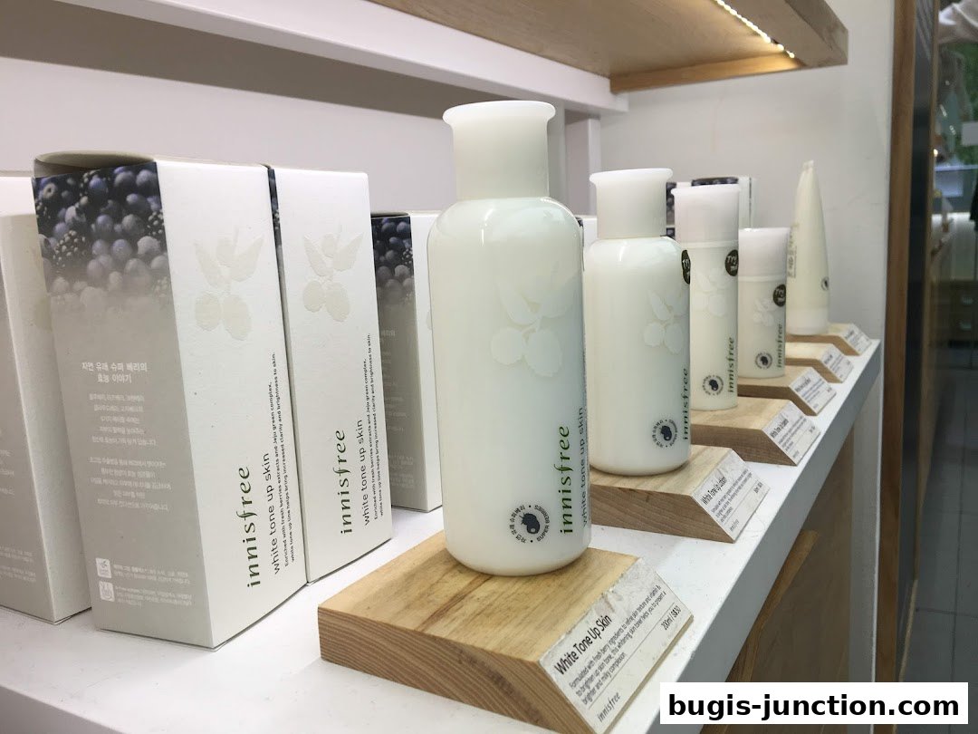 Innisfree skincare products, including bottles and boxes, displayed on shelves.