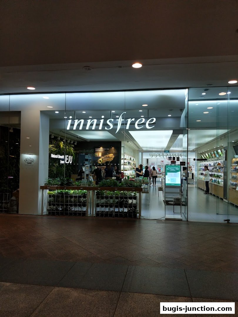 The exterior of the Innisfree Bugis Junction store, showcasing its entrance and interior.
