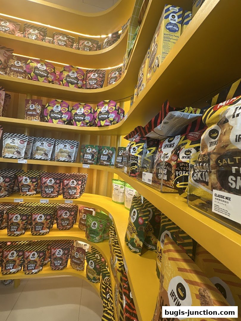 Shelves stocked with various IRVINS snacks, including potato chips and salmon skin.