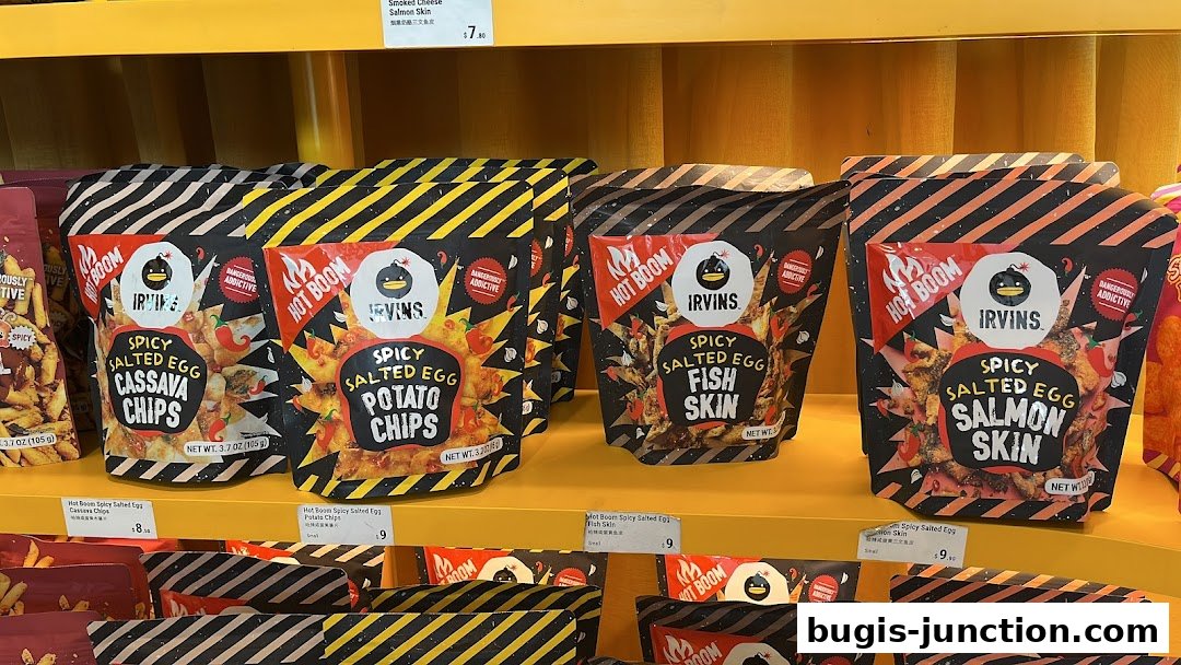 Assortment of IRVINS Spicy Salted Egg snacks including Cassava Chips, Potato Chips, Fish Skin, and Salmon Skin.
