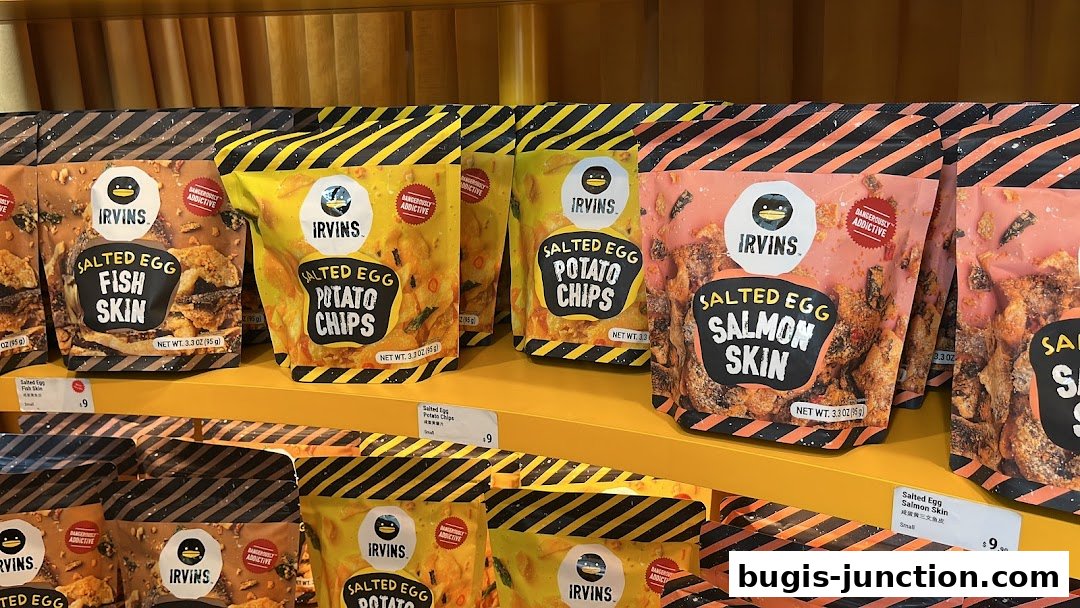Assortment of IRVINS salted egg snacks including fish skin, potato chips, and salmon skin.