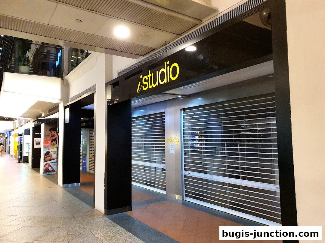 The exterior of the iStudio Bugis Junction store with its shutters down.