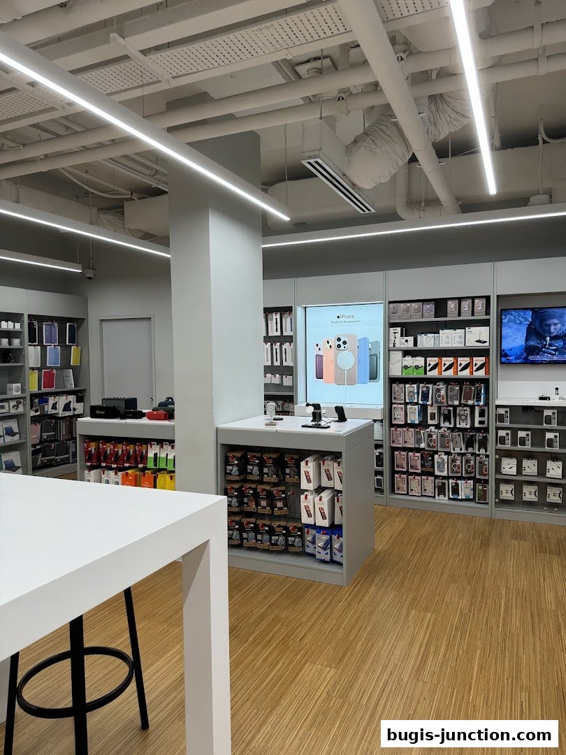 Interior view of an iStudio store showcasing Apple products and accessories.