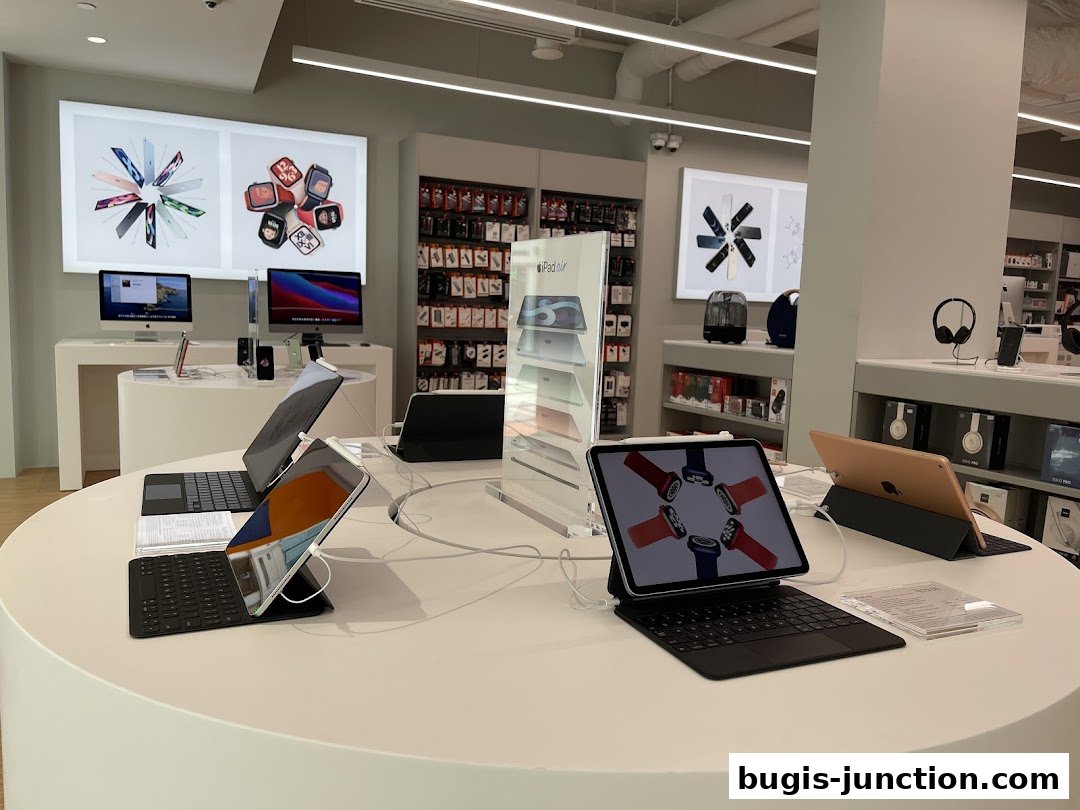 Interior view of an iStudio store showcasing Apple products like iPads and accessories.