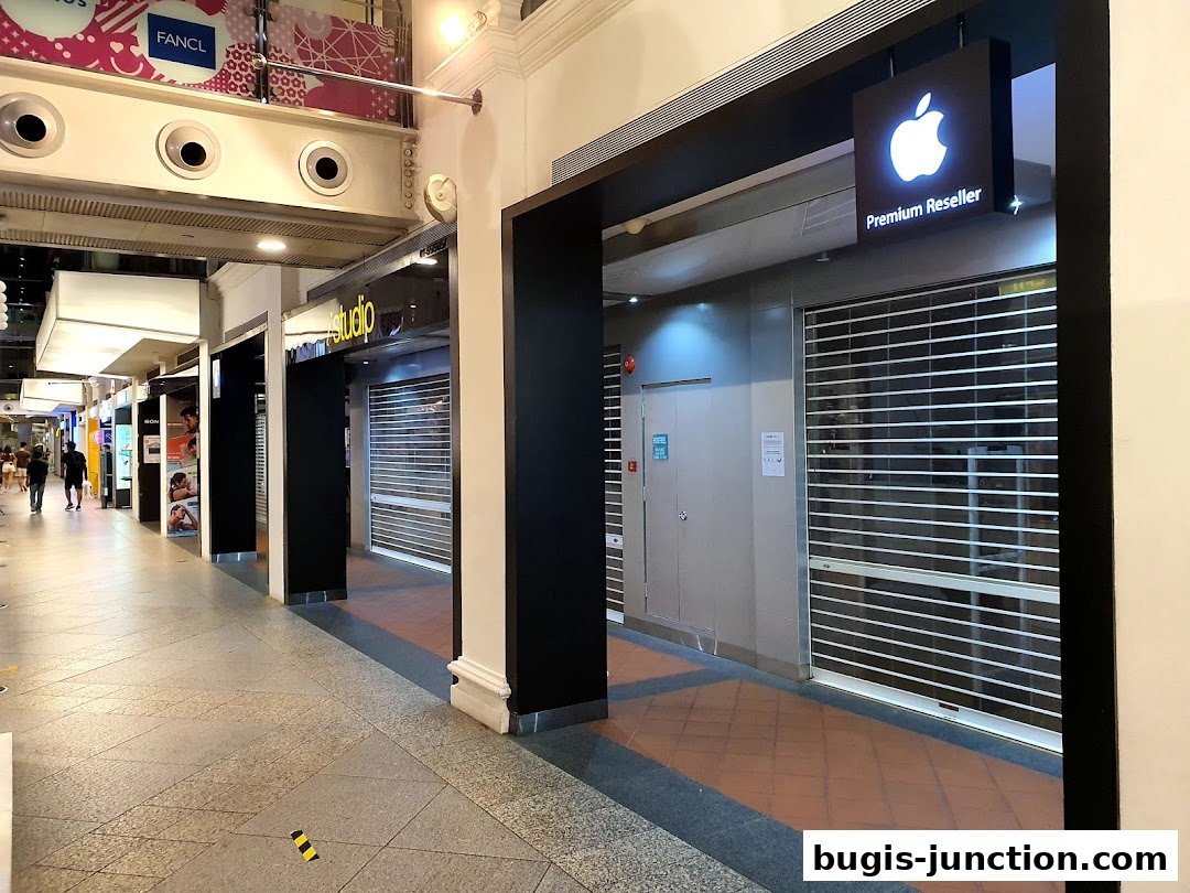 The exterior of the iStudio Bugis Junction shop and an Apple Premium Reseller store.
