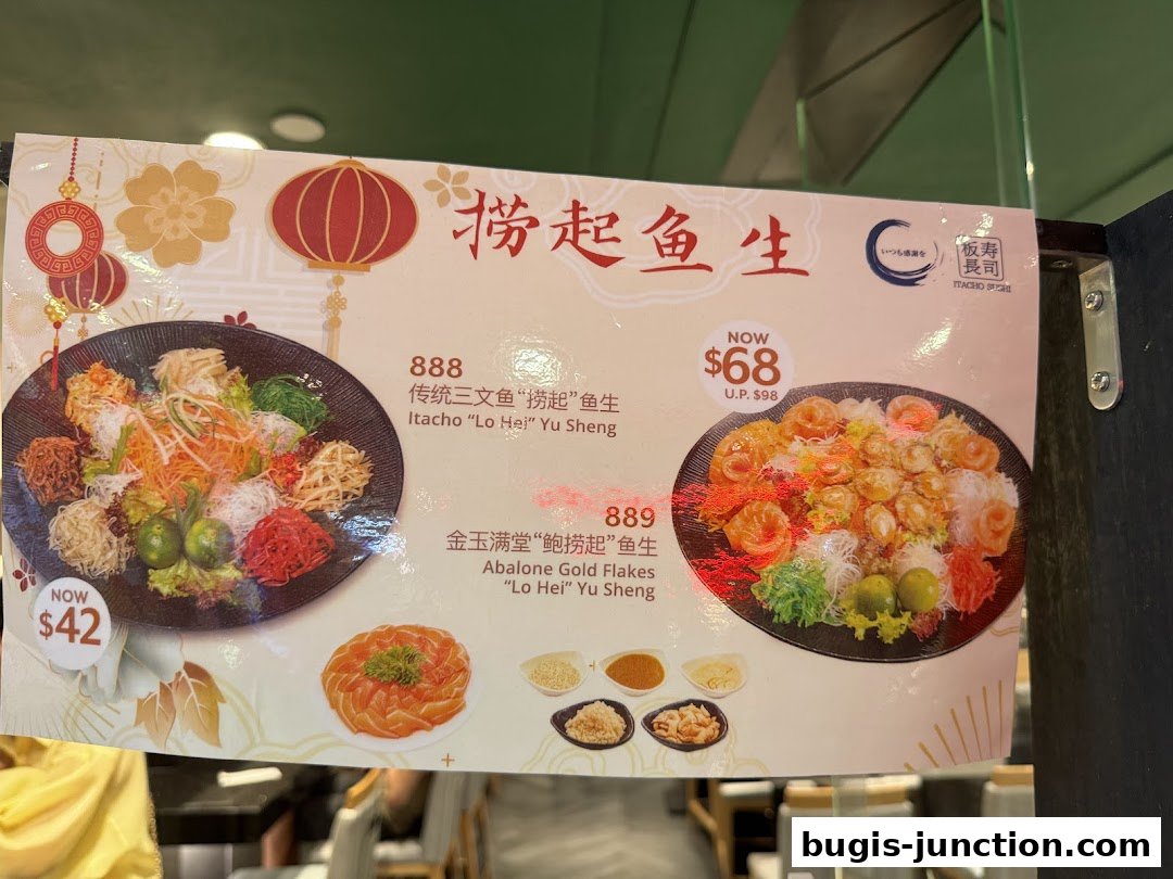 A menu board from Itacho Sushi featuring two Yu Sheng dishes with prices.