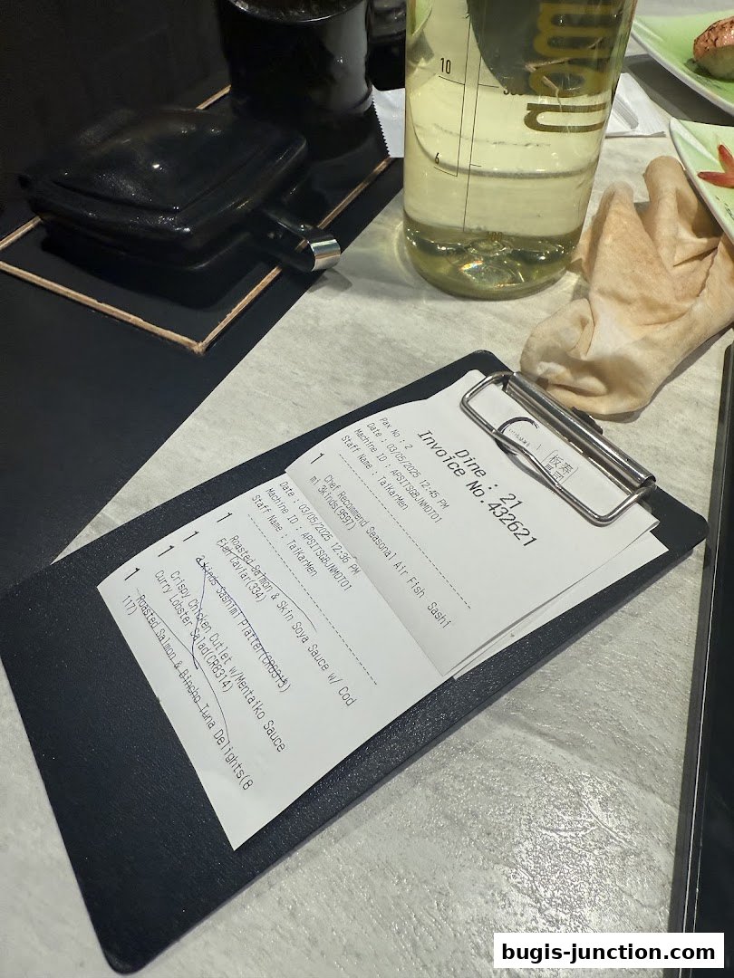 A receipt from Itacho Sushi detailing various sushi and seafood dishes.