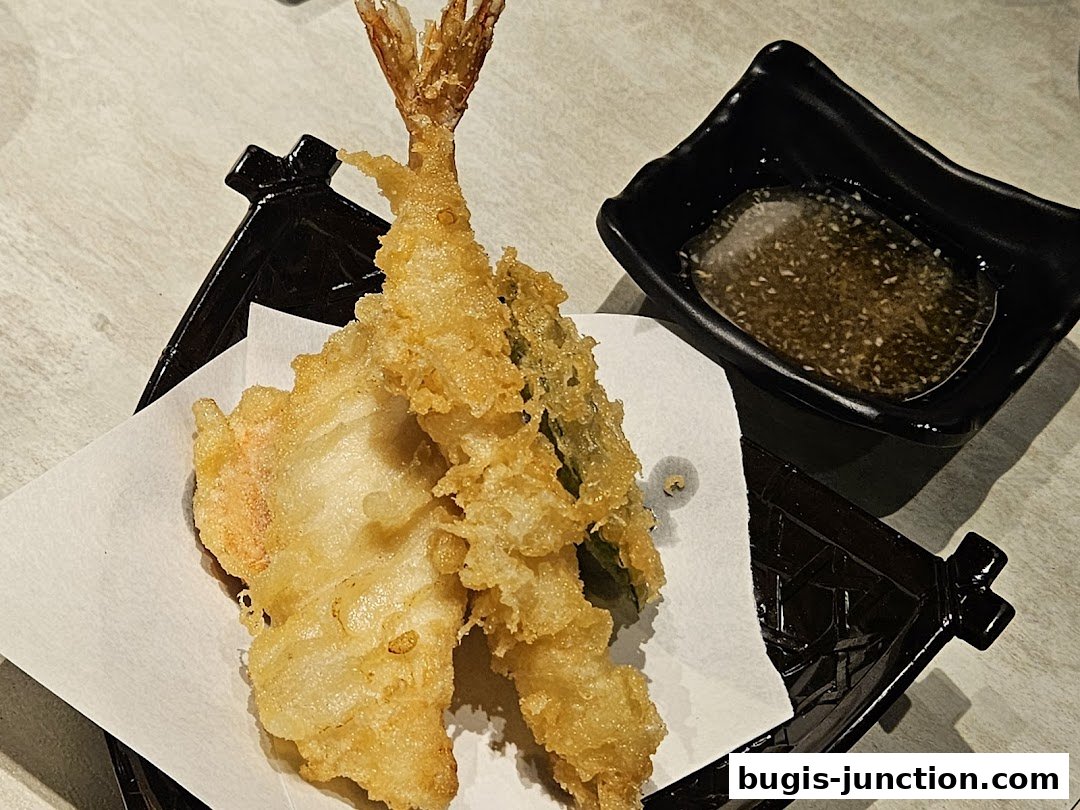 Crispy tempura shrimp and vegetables served with dipping sauce.