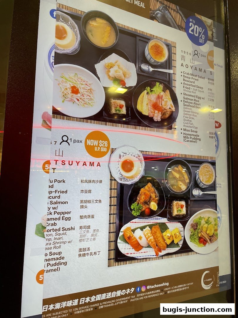 A menu display featuring Japanese set meals with various sushi and side dishes.
