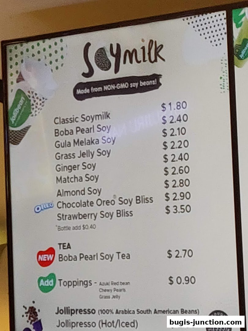 A menu board for Jollibean featuring various soymilk drinks, teas, and coffee.