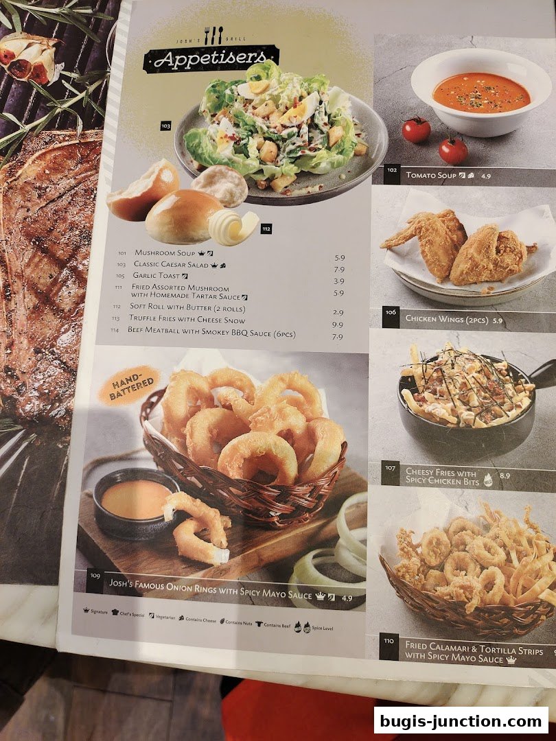 A menu page from Josh's Grill featuring appetizers like onion rings, chicken wings, and salads.
