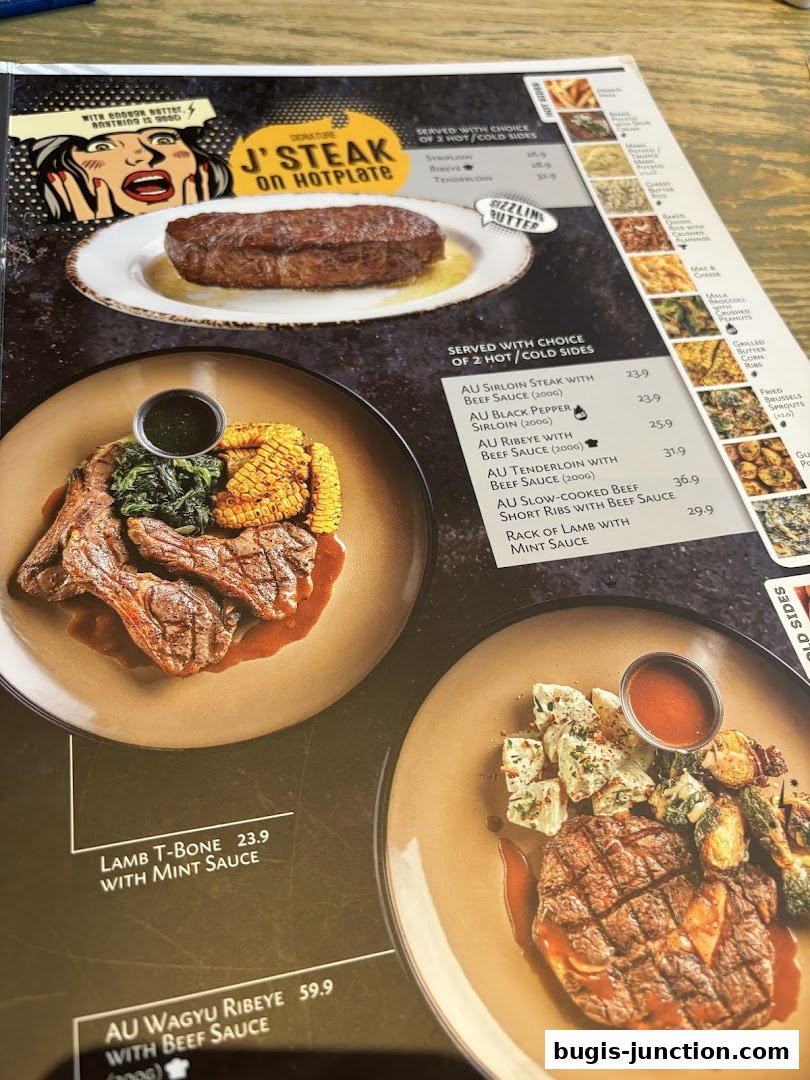 A menu from Josh's Grill featuring steaks, lamb, and various side dishes.