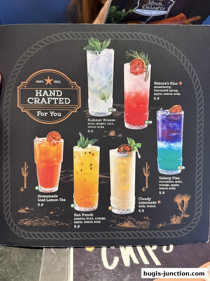 A menu page from Josh's Grill showcasing various handcrafted beverages with vibrant colors and garnishes.