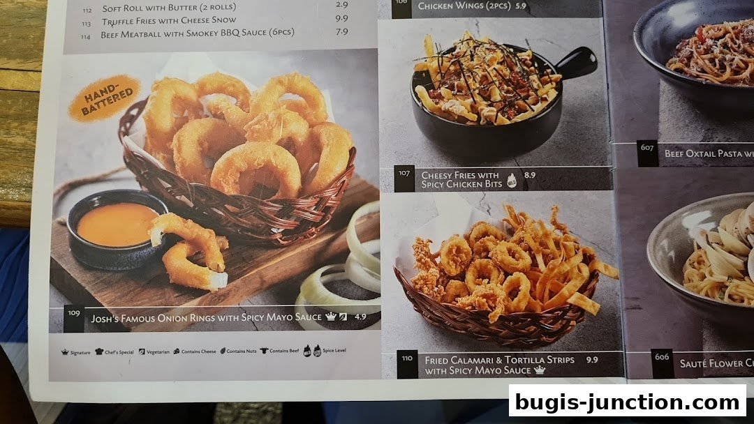 A menu featuring Josh's Famous Onion Rings and other appetizers.