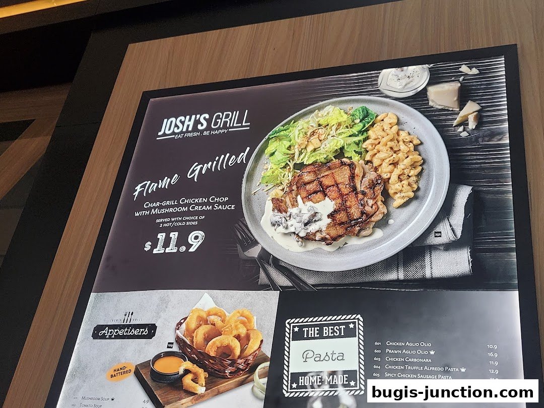 A menu display featuring Josh's Grill's flame-grilled chicken chop and various pasta dishes.