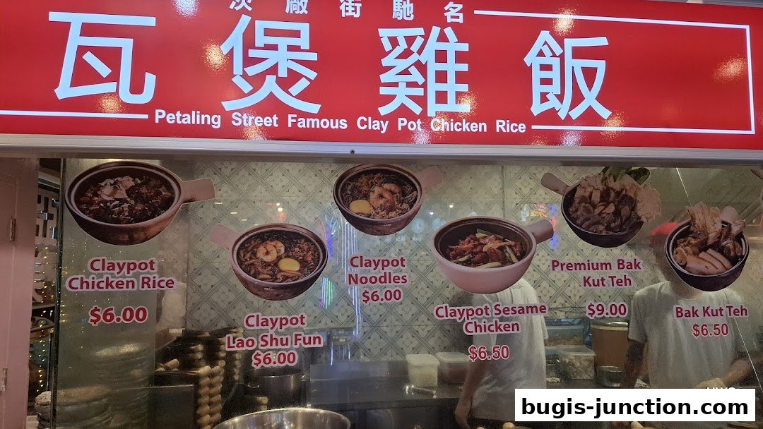 A shop window displaying various clay pot dishes and Bak Kut Teh with prices.