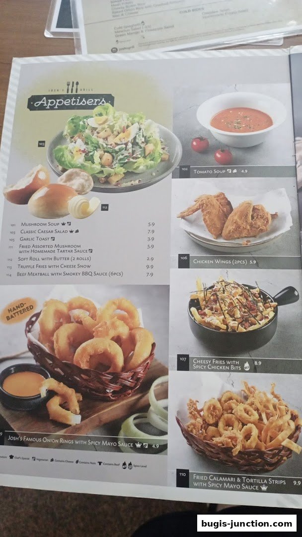 A menu from Josh's Grill featuring appetizers like onion rings, chicken wings, and fries.