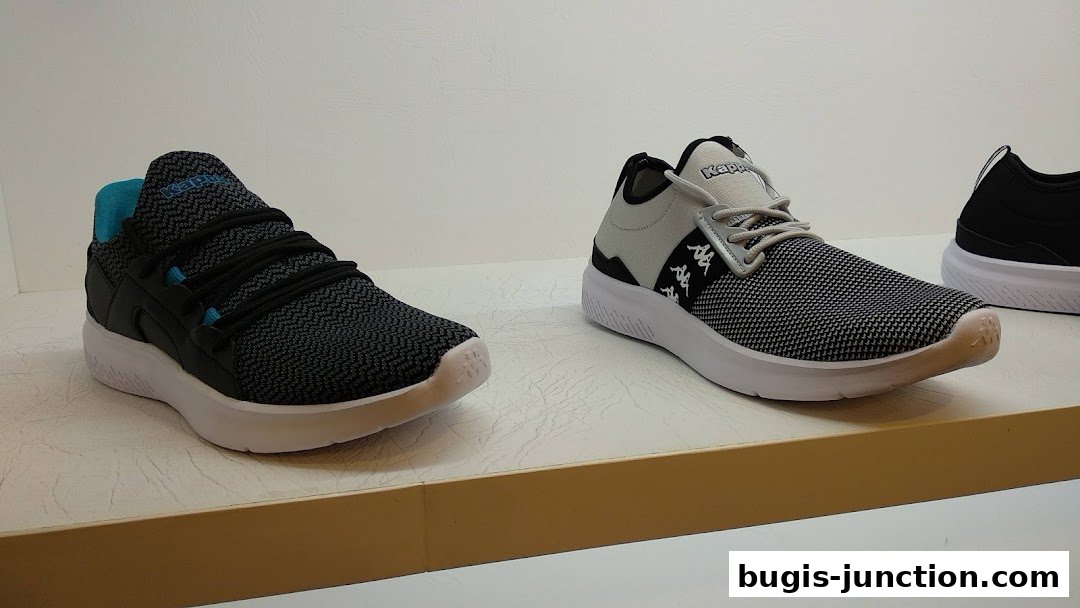 A display of Kappa brand athletic shoes on a shelf.
