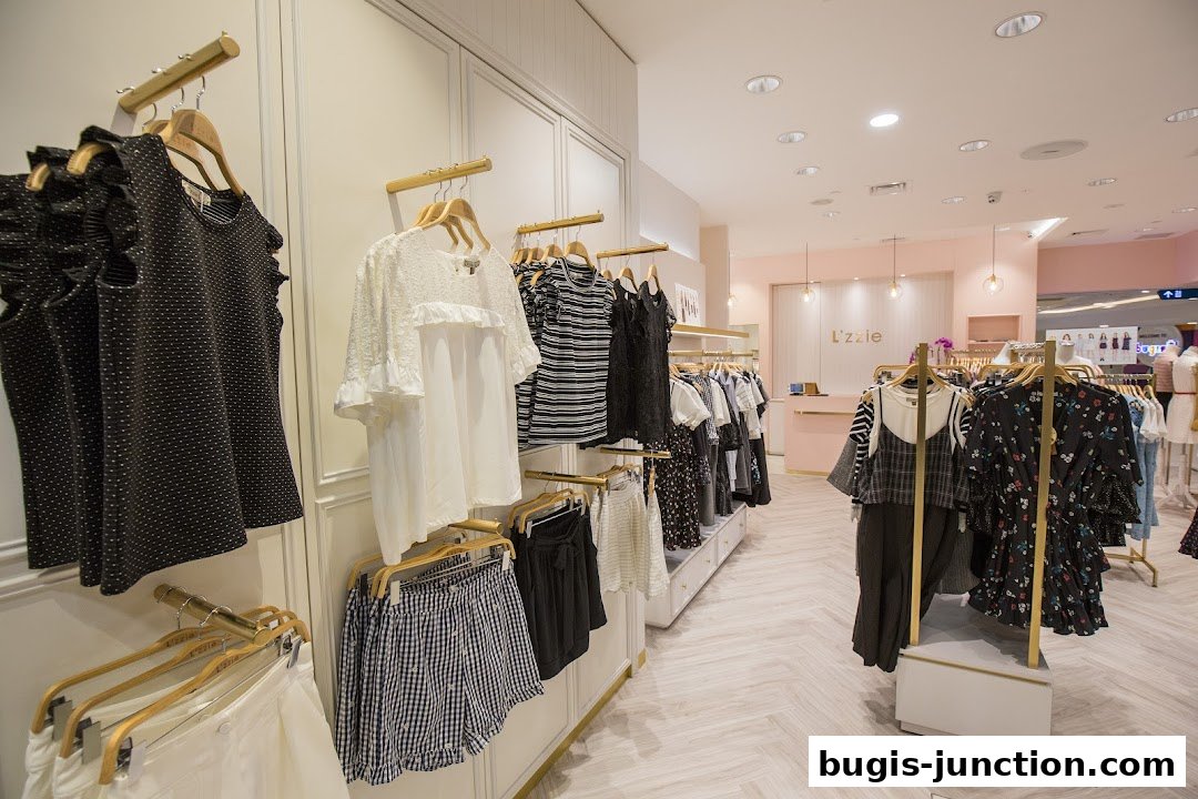 Interior view of a clothing store with racks of women's apparel and a counter.